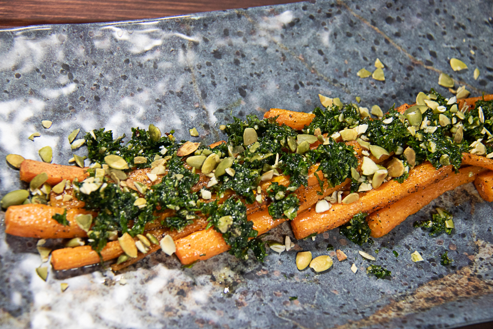 Roasted Carrots with Carrot Top Gremolata on serving dish
