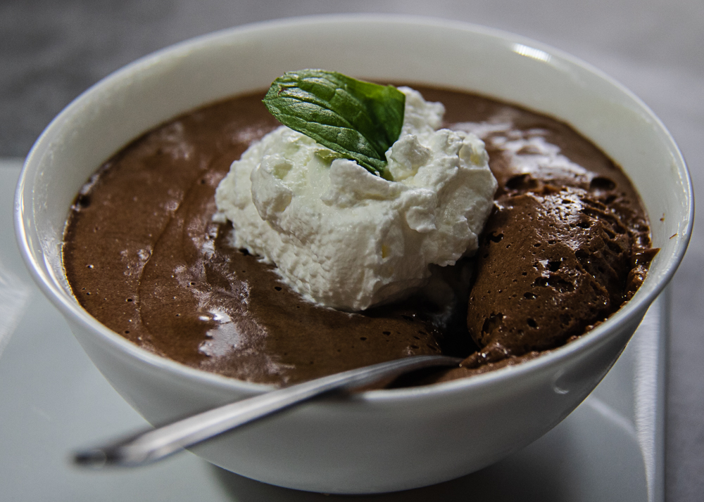 cold chocolate souffle in ramekin with spoon