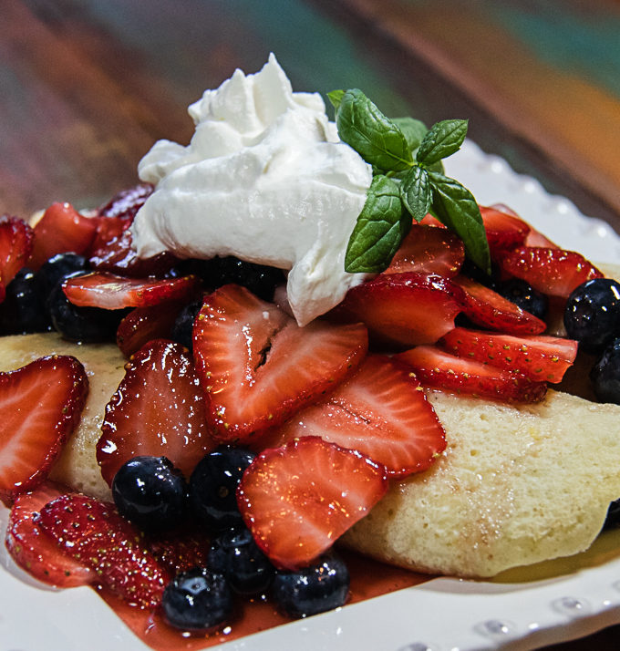 easy berry crepes on a plate
