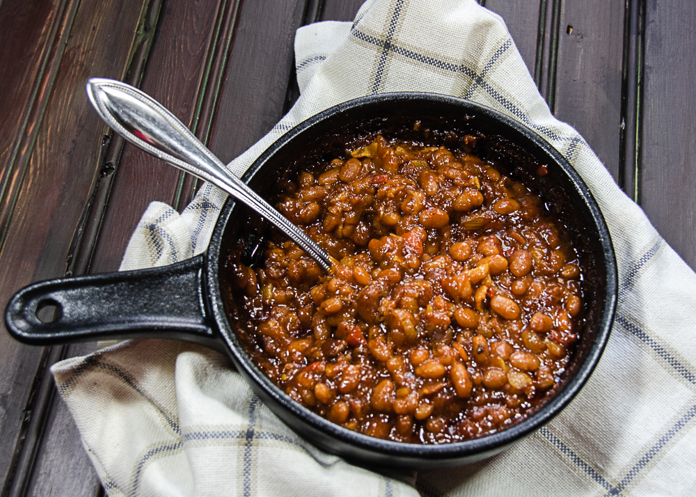 Easy cowboy baked beans in dish with spoon