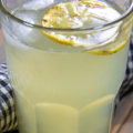 fresh squeezed lemonade in glass with lemon slice