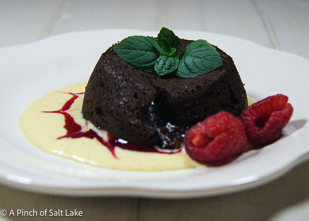 chocolate molten lava cake on plate with raspberries