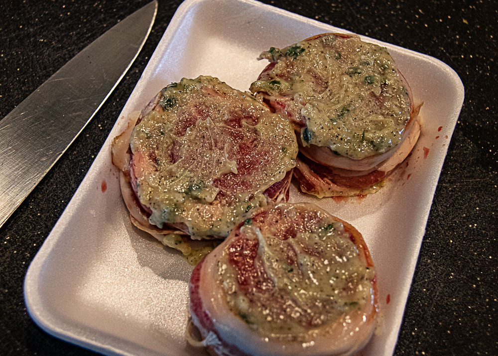 garlic herb butter on bacon wrapped filet mignon
