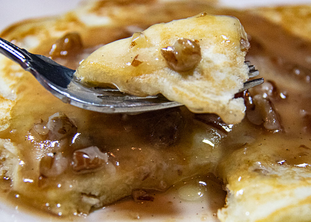 close up of buttermilk pancakes with pecan praline syrup