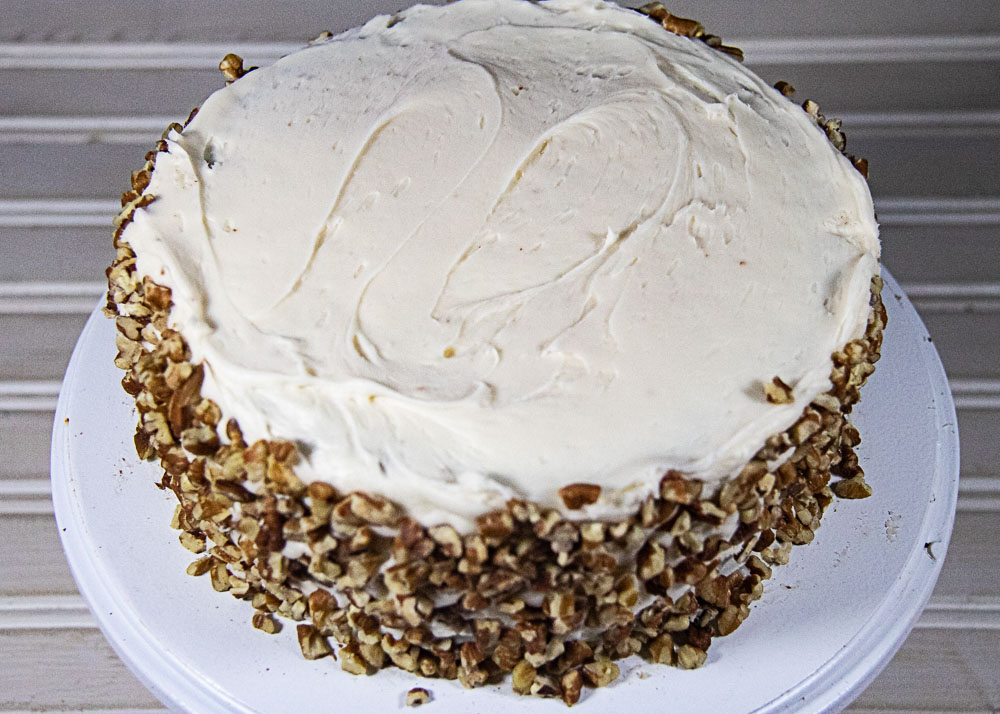 cream cheese frosting and pecans on sides