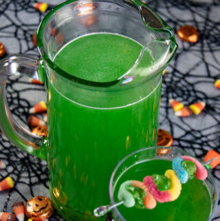 ectoplasm Halloween drink with a gummyworm garnish