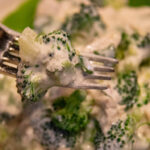 high protein chicken and broccoli salad bite on a fork